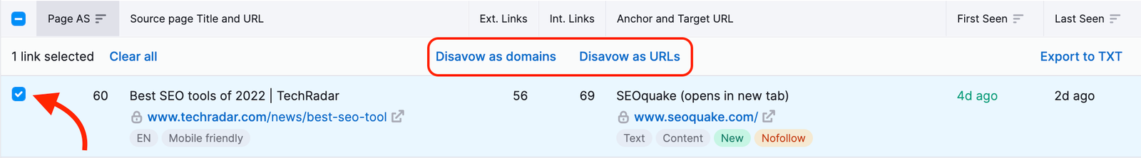 A red arrow is pointing to the select box and the Disavow as domains and Disavow as URLs buttons are highlighted above the selected backlink.